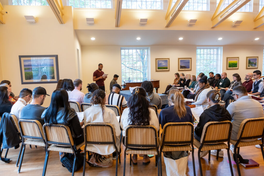 Group of young adults congregating for informal service